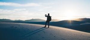 Someone on a hiking getaway taking a picture of a vast landscape.